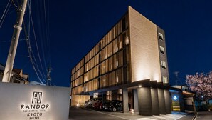 A modern hotel building with a sign for 'RANDOR Residential Hotel Kyoto Suites.' - Randor Residential Hotel Kyoto Suites (Kyoto)
