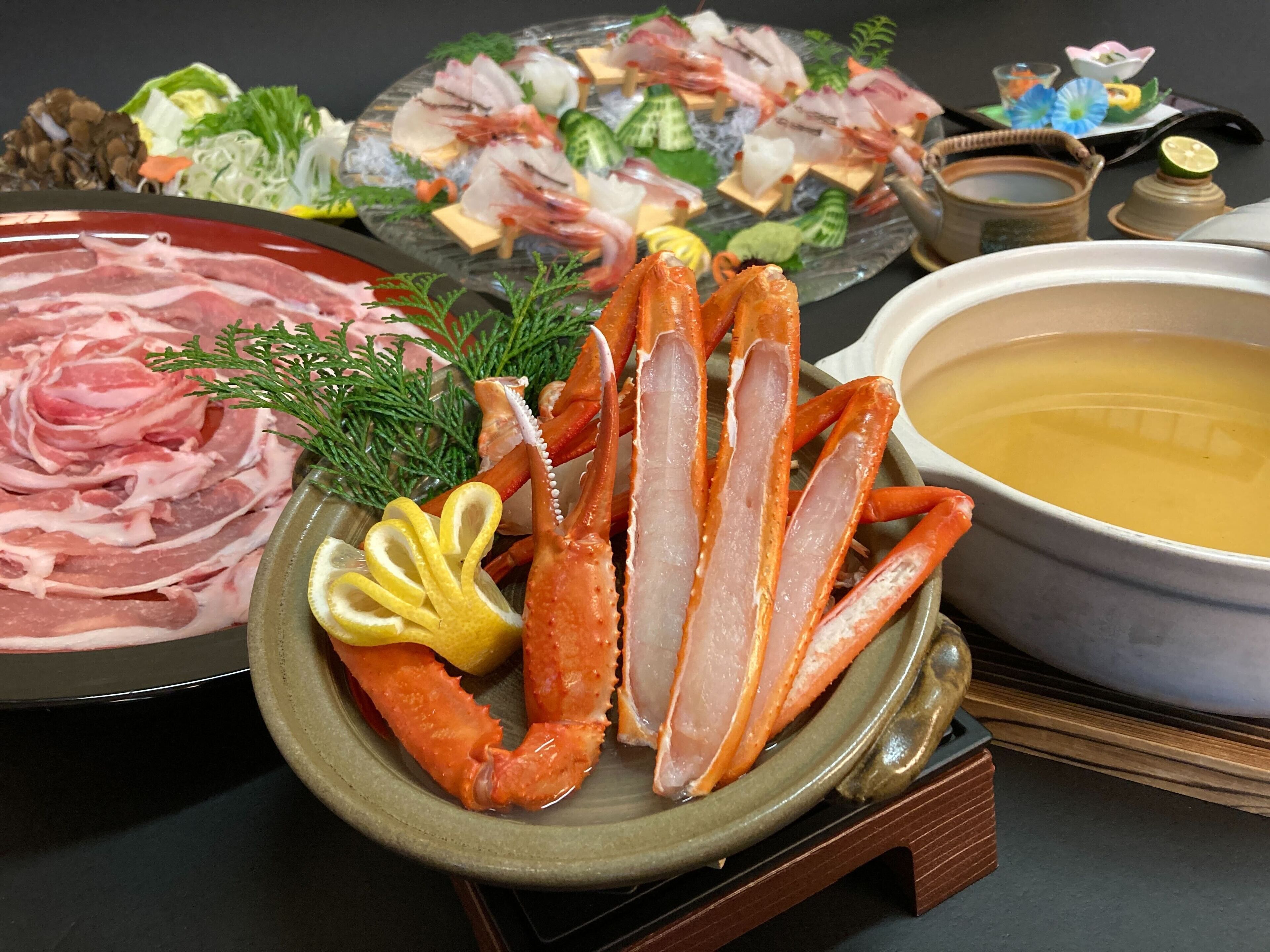 A seafood platter with various types of fish and seafood, including crab legs, arranged on a plate.