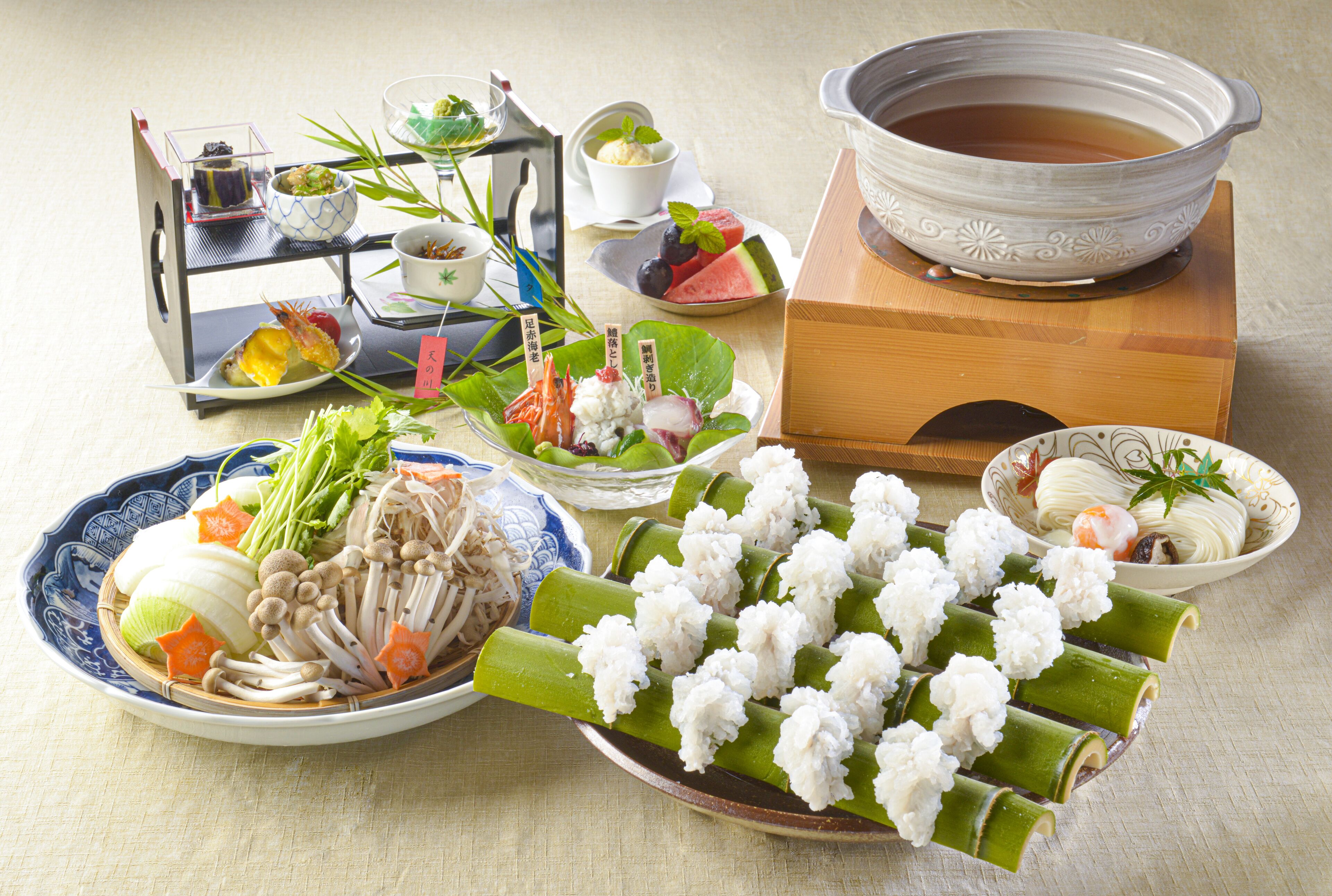 A traditional Japanese meal setup with various dishes and a tea bowl.