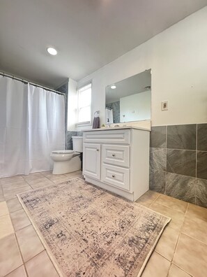 Combined shower/tub, hair dryer, towels, soap