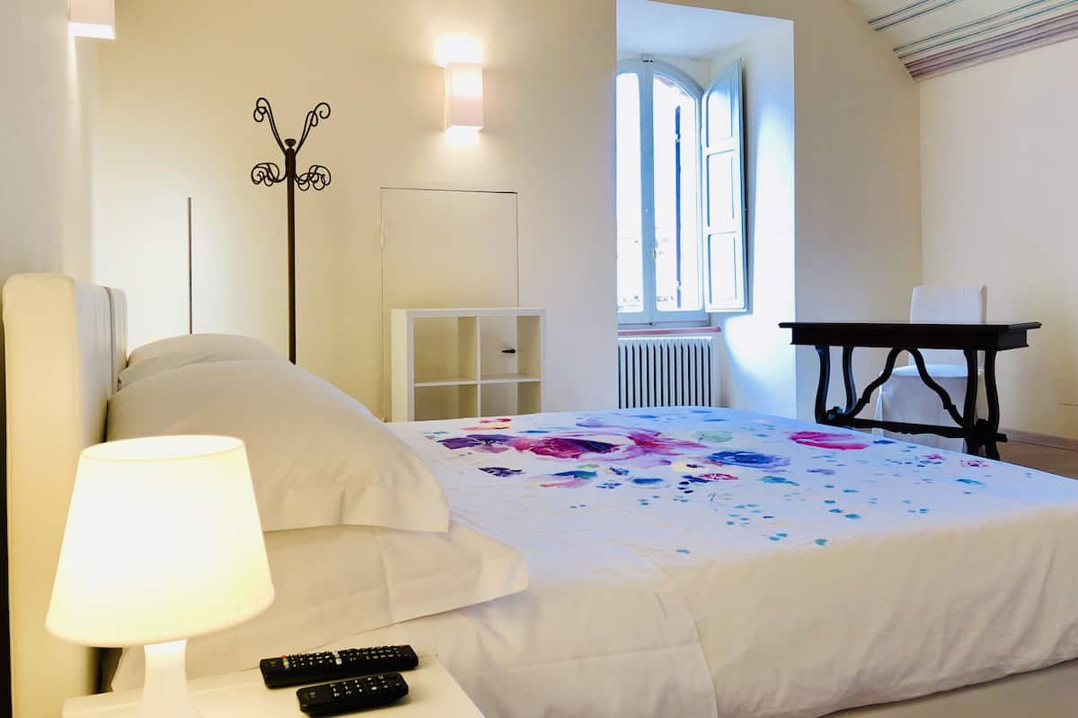Classic Quadruple Room | Desk, laptop workspace, blackout drapes, free WiFi