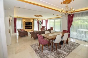 Business Villa, 4 Bedrooms | Living room | 120-cm LCD TV with satellite channels, TV, fireplace - Bahar Villas Sapanca (Sapanca)