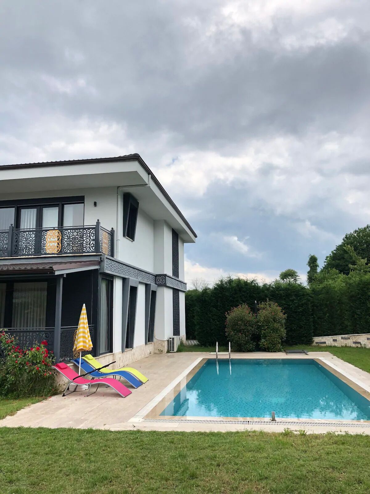 Seasonal outdoor pool, pool umbrellas, pool loungers