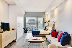 Luxury Room | Living area | 50-inch TV with satellite channels, Netflix, streaming services - City View Balcony Apartment 908 (Cape Town)