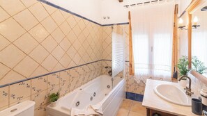 Bathtub, hair dryer, towels