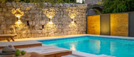 Seasonal outdoor pool, pool loungers