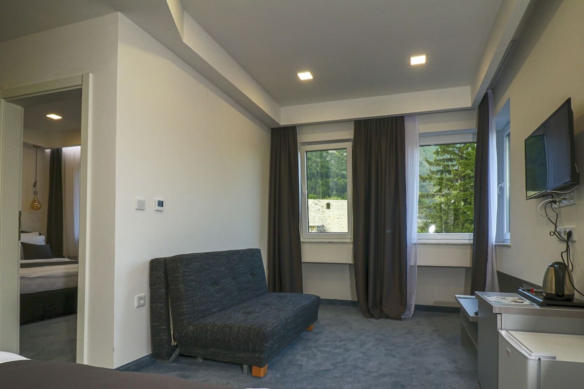 Family Suite | Living area | Flat-screen TV