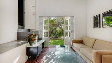 Luxury Apartment, Pool View | Living area | 43-inch flat-screen TV with satellite channels, TV