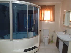 Shower, towels, soap, toilet paper