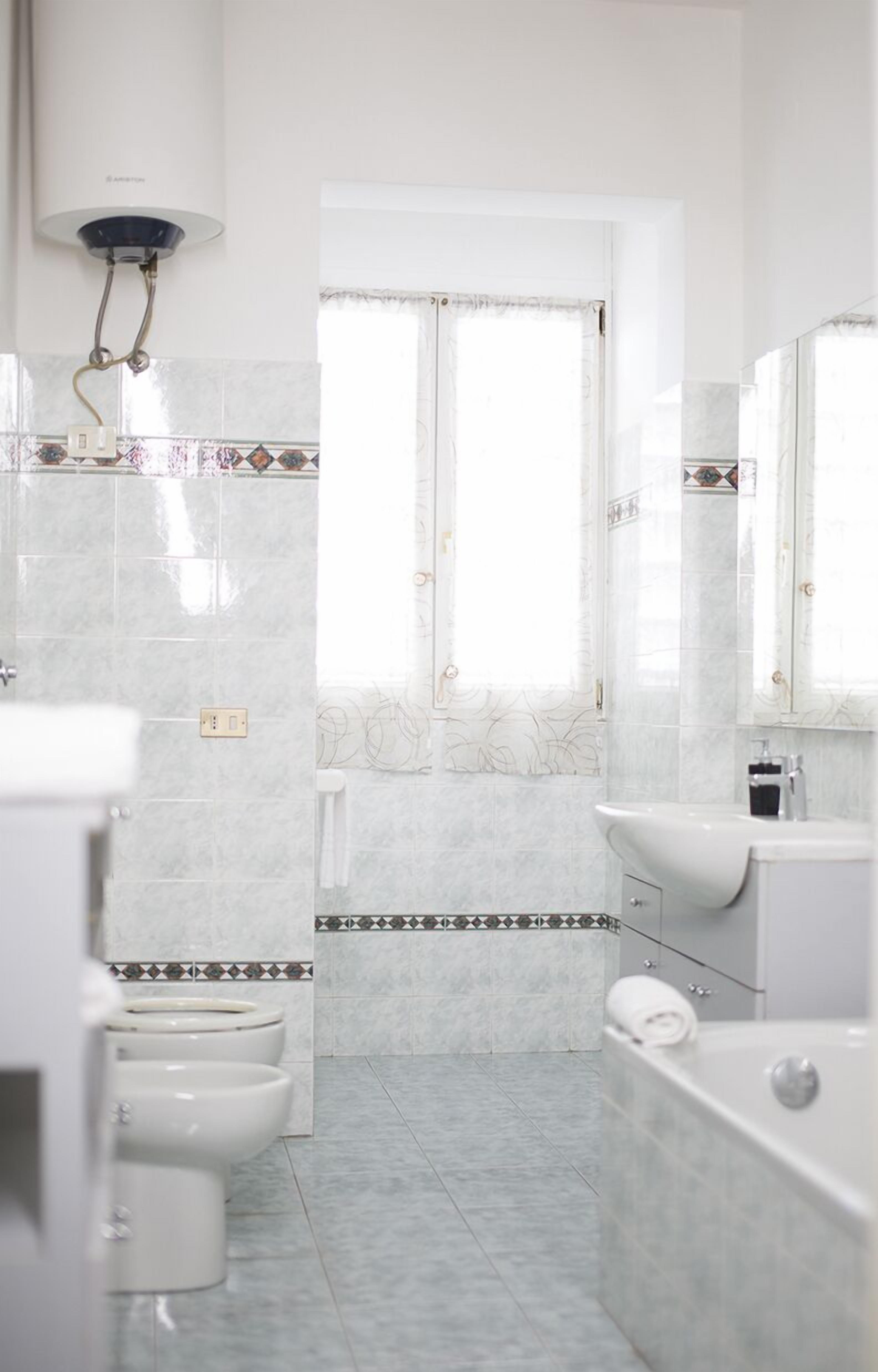 Separate tub and shower, rainfall showerhead, free toiletries