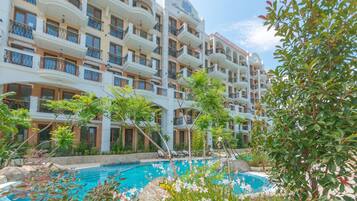 Seasonal outdoor pool, pool umbrellas, pool loungers