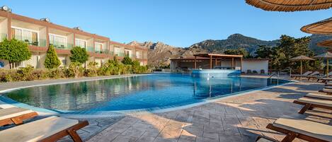 Seasonal outdoor pool, open 10:00 AM to 6:30 PM, pool umbrellas