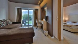 A modern hotel room with two beds, a desk, and a large window. - Anavadia Hotel By Anayia All Inclusive Resorts (Rhodes)