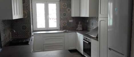 Fridge, oven, dining tables