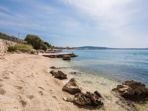 On the beach, sun loungers, beach towels
