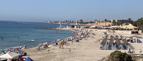 On the beach, sun-loungers, beach towels