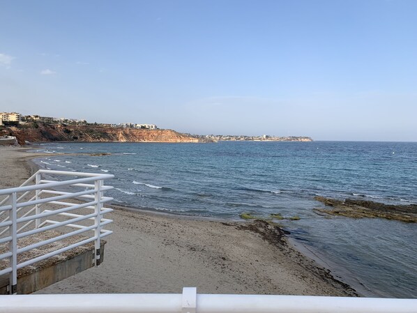On the beach, sun-loungers, beach towels