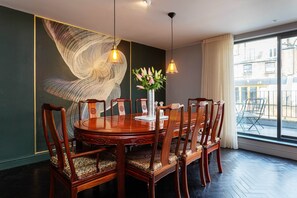Enjoy meals in this elegant dining room with a round table and six comfortable chairs.
