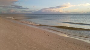 A beach with a clear sky and calm sea. - Marco Island Pool Home with Water View and Direct Access to the Gulf (Marco Island)