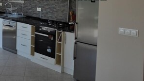 Villa, 4 Bedrooms | Private kitchen | Full-size fridge, microwave, oven, stovetop