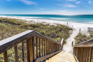 A wooden boardwalk leading to a beach with clear blue water and sandy dunes. - BEST Location on 30A, FREE Beach Setup/Gear on Private Beach & Heated Pool! (Santa Rosa Beach)