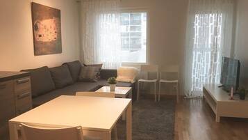 Apartment, 1 Bedroom | Living room | Smart TV
