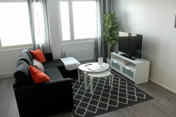 Apartment, 1 Bedroom | Living room | Smart TV