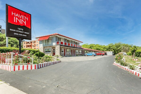 A Haven Inn hotel with a red and white facade, located at 1870 Main Street West. - Haven Inn (Hamilton)