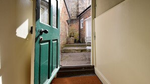 A narrow stairway leading to a brick exterior. - 87 Micklegate (York)
