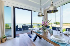 Dining - Luxury villa "Lighthouse" on the waterfront with garden, roof terrace, sauna and sea view (Olpenitz)