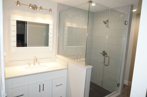 Combined shower/tub, hair dryer, towels, soap
