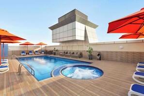 Outdoor pool, open 8:00 AM to 7:00 PM, pool umbrellas, sun loungers