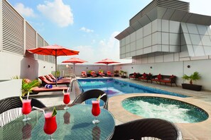 Outdoor pool, open 8:00 AM to 7:00 PM, pool umbrellas, pool loungers - Ramada by Wyndham Dubai Deira (Dubai)