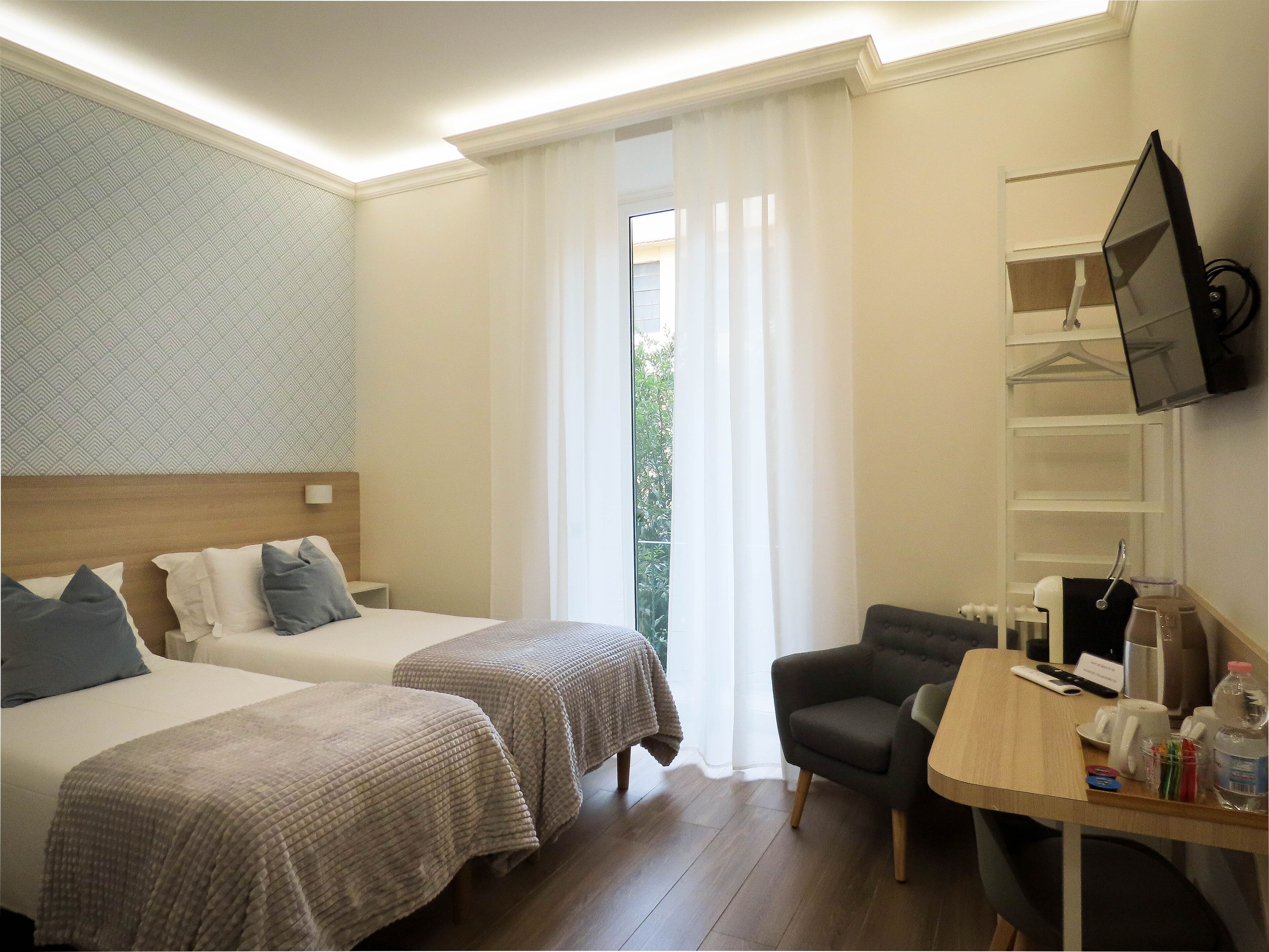 Habitación Deluxe con 1 cama doble o 2 individuales | Ropa de cama de alta calidad y decoración individual