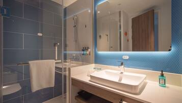 Room, 1 King Bed, Accessible, Non Smoking (Mobility Roll-In Shower) | Bathroom | Shower, slippers, towels
