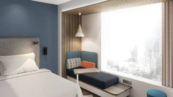A modern hotel room with a bed, a seating area with a view of the city, and a window with curtains.