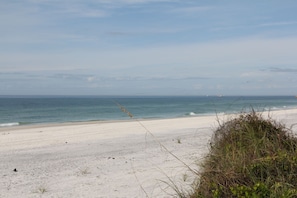 On the beach, sun loungers, beach towels