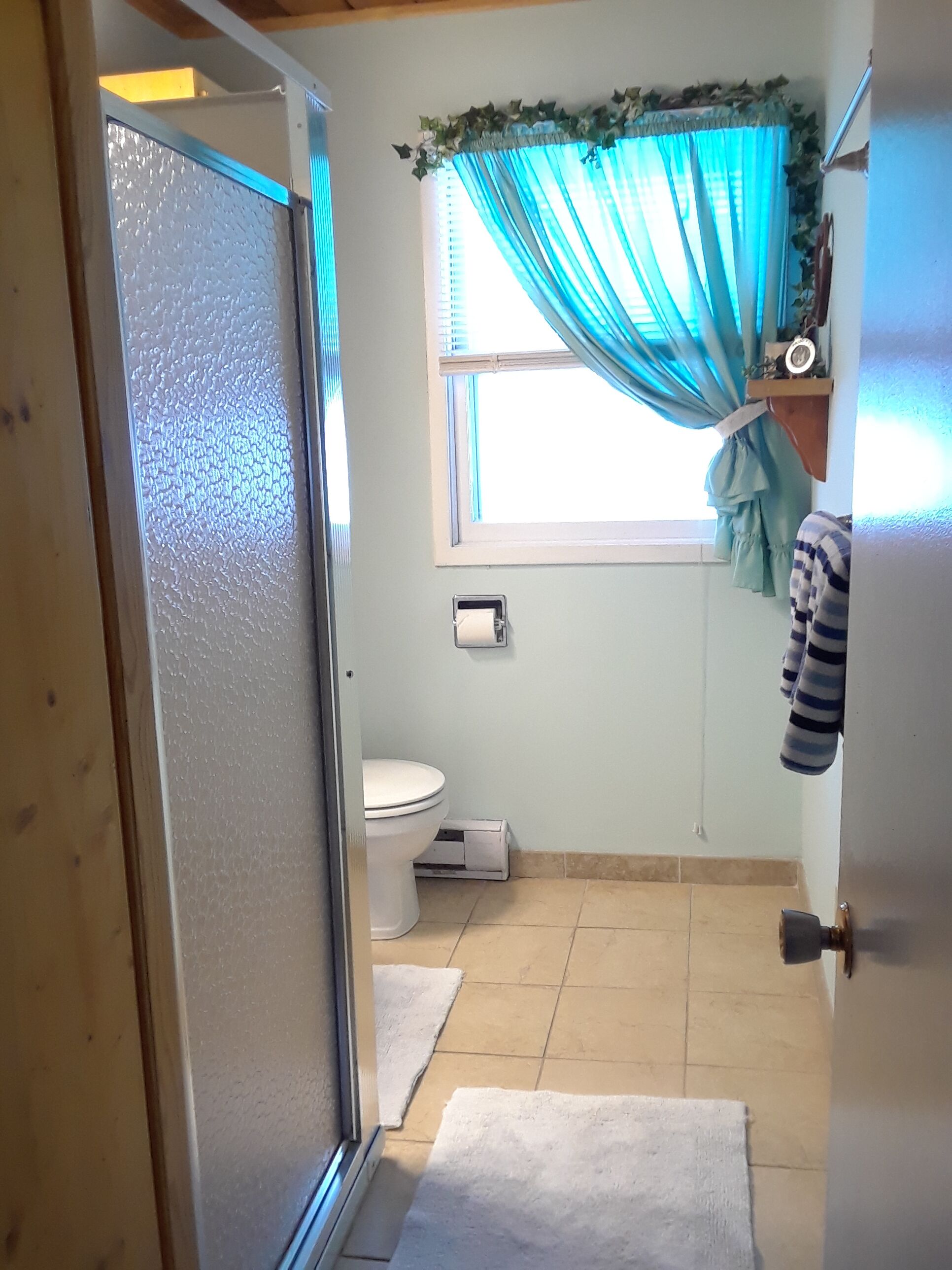 larger bath with shower