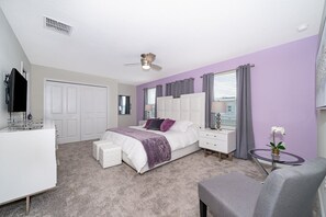 A bedroom with a bed, bedside tables, a desk, a chair, a ceiling fan, and a window with curtains. - (JD8821) Champions Gate 6/6, Private Pool with Spa & Free Waterpark (Kissimmee)