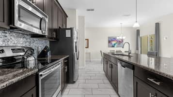 Coffee/tea maker, fridge, microwave, oven