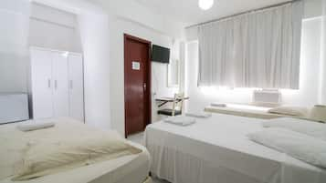 Executive Quadruple Room | Minibar, laptop workspace, blackout curtains, free WiFi