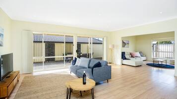 Family House, 4 Bedrooms, Non Smoking | Living area | 22-inch flat-screen TV with digital channels, TV, DVD player