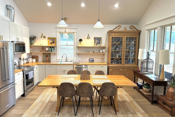 fully stocked kitchen, open to living room