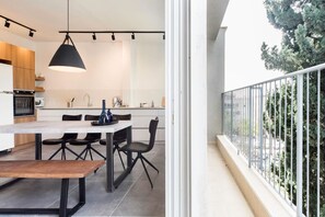 Enjoy meals in the kitchen with a sink and dining area.