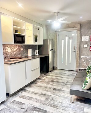 Apartment | Private kitchenette | Full-sized fridge, microwave, stovetop, coffee/tea maker - Tapia Haus 103 (San Juan)