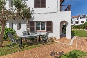 Outdoor dining - Beautiful Apartment "La Gardenia 41" with Wi-Fi, Pool, Terrace & Garden; Street Parking Available (Es Castell)