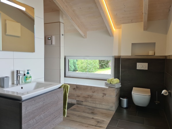 Bathtub, hair dryer, towels, soap