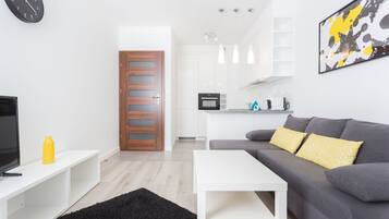 Comfort Apartment | Living area | TV