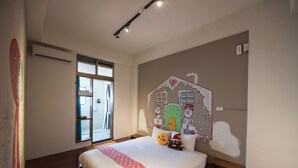 A bedroom with a large bed, a window, a wall mural, and a wooden floor. - Anping Pet Island (Tainan)
