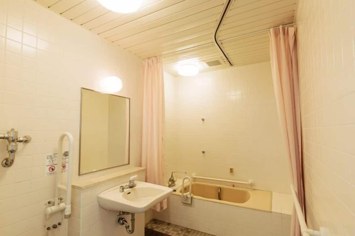 Bathroom | Hair dryer, slippers, electronic bidet, towels
